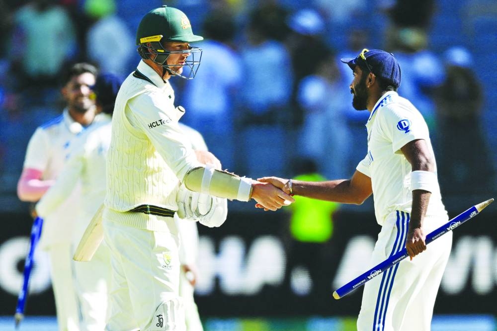 
Australia’s Josh Hazlewood shakes hands with India’s Jasprit Bumrah after the first Test at Optus Stadium, Perth, Australia, on November 25, 2024. (Reuters) 