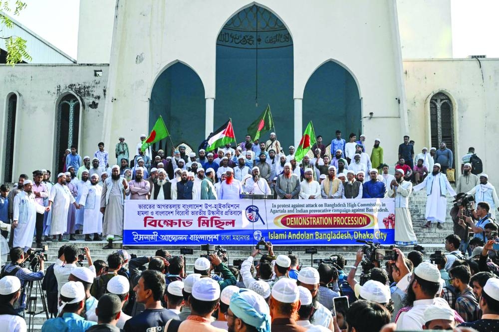 Islami Andolan Bangladesh party members hold a demonstration at the Baitul Mukarram National Mosque in Dhaka yesterday in protest against the breach of premises at the Bangladesh assistant high commission in Agartala. (AFP)