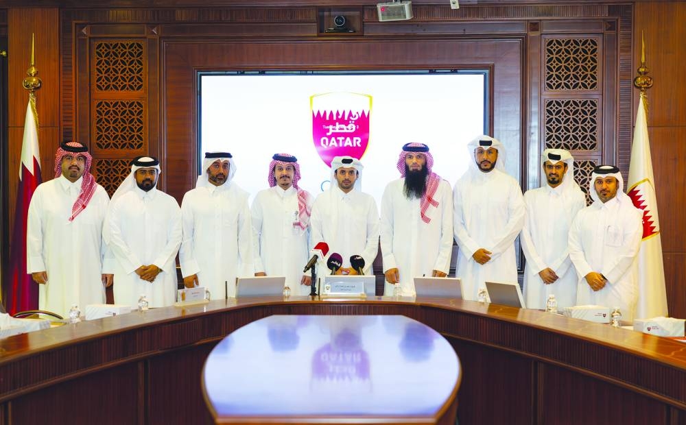 Chairman of the Race’s Organizing Committee Sheikh Suhaim bin Mohammed al-Thani, Executive Director of the Qatar Athletics Federation Khalid Rashid al-Marri, QOC’s Assistant Director of the Sports Events Department Salah Mahmoud al-Saadi and QOC’s Head of Media Relations Sheikh Hamad bin Abdulaziz al-Thani along with other officials pose for a group photo