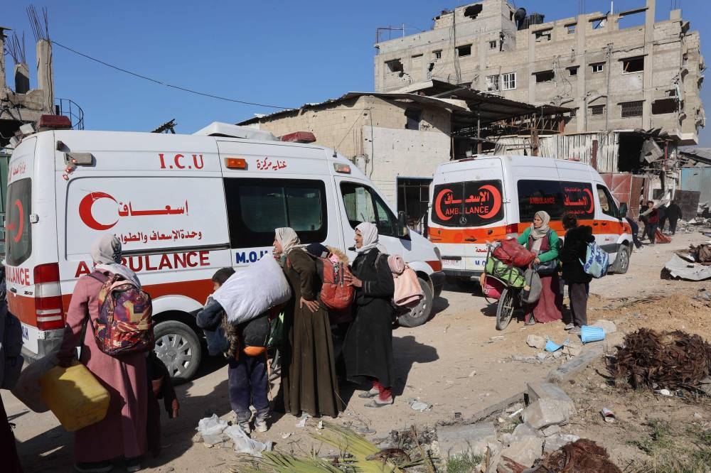 Ambulances transporting wounded Palestinians drive on the main Salah al-Din road in Jabalia in the northern Gaza Strip on Wednesday. AFP