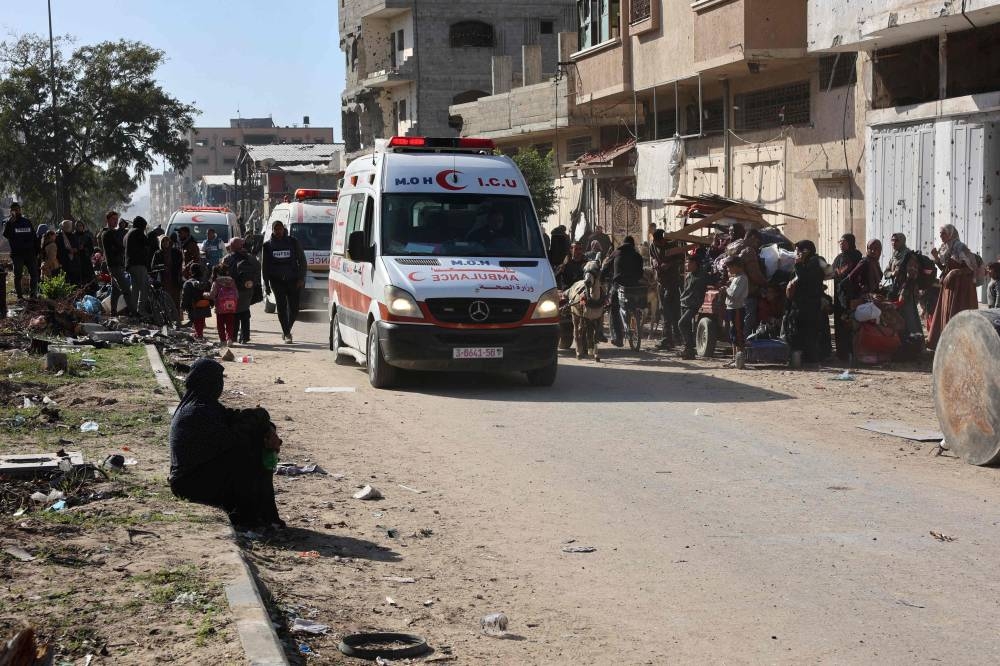Ambulances transporting wounded Palestinians drive on the main Salah al-Din road in Jabalia in the northern Gaza Strip on Wednesday. AFP