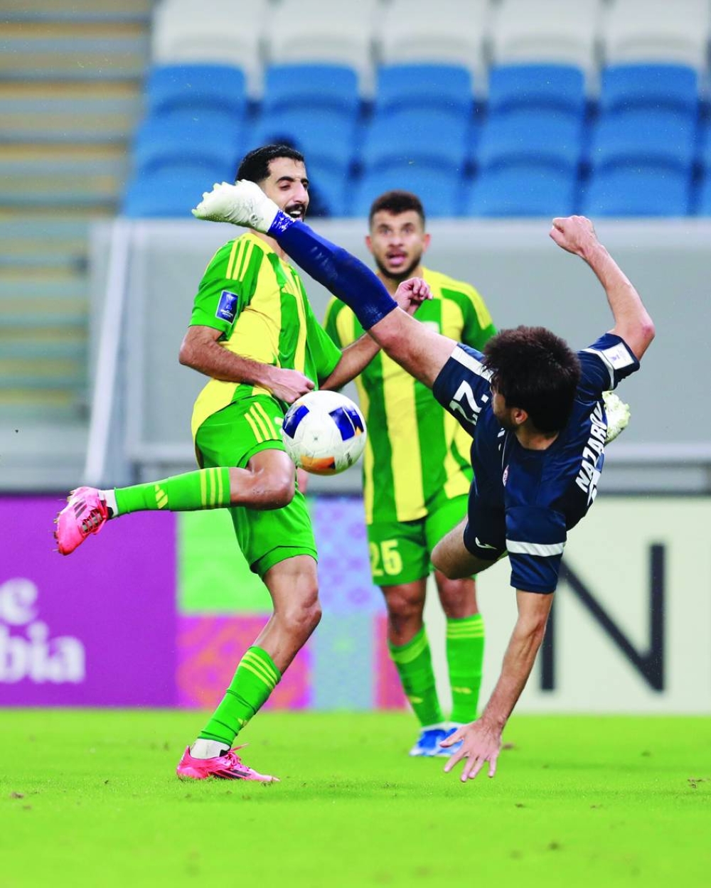 
Al Wakrah and Ravshan players vie for the ball during the AFC Champions League Two Group A match at the Al Janoub Stadium. 