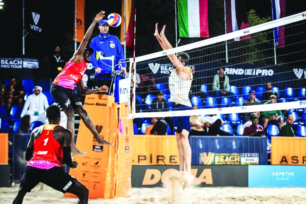 Qatar’s Ahmed Tijan goes for a smash as partner Cherif Younousse looks on during their match against Italy’s Paolo Nicolai and Samuele Cottafava on the opening day of the Beach Pro Tour Finals 2024 at Aspire Zone on Wednesday.