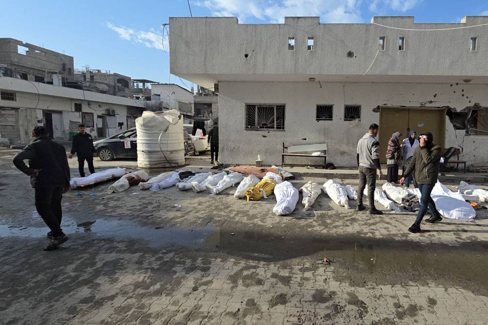 The bodies of victims lie in the courtyard of the Kamal Adwan hospital in Beit Lahya in the northern Gaza Strip, following a reported Israeli strike that hit the medical complex on Friday. AFP
