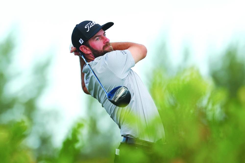 
Cameron Young of the US plays his shot from the fourth tee during the second round of the Hero World Challenge 2024 at Albany Golf Course in Nassau, Bahamas. (AFP) 