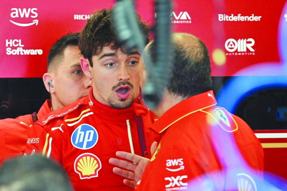 
Ferrari’s Monegasque driver Charles Leclerc reacts as he stands in the pits ahead of the first practice session. (AFP) 