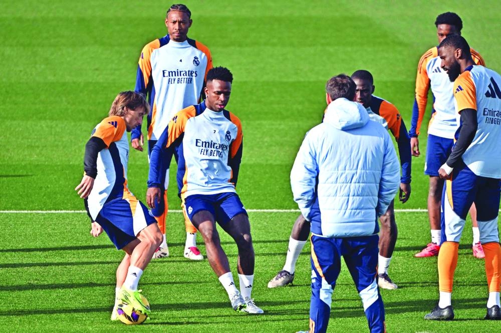 Real Madrid’s Vinicius Junior (third left) trains with teammates in Valdebebas, outside Madrid, on Friday. (AFP)