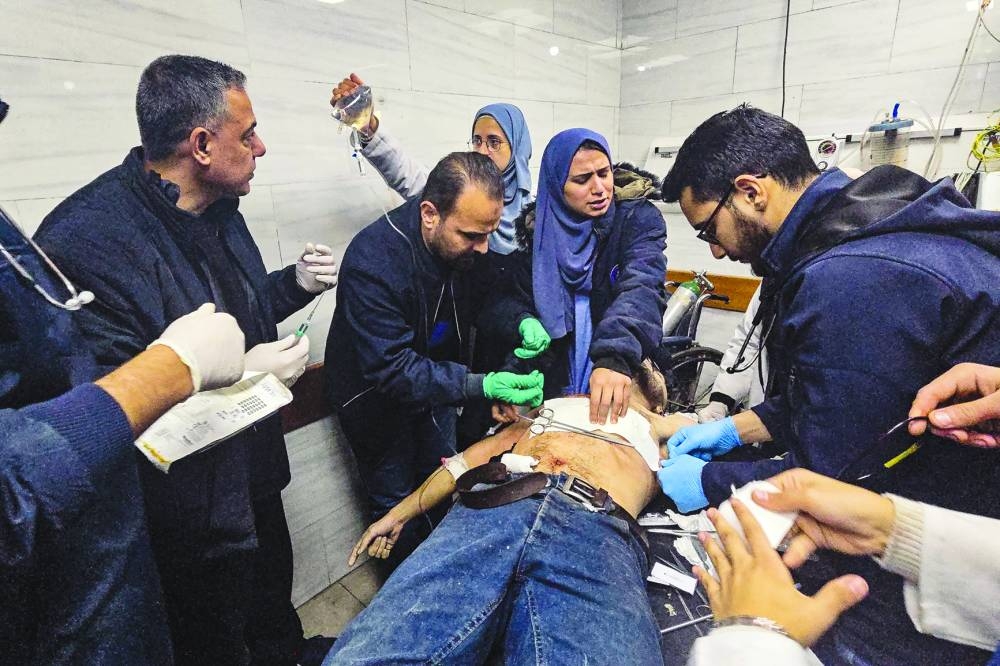 
A victim is treated inside the Kamal Adwan hospital in Beit Lahia in the northern Gaza Strip. 
