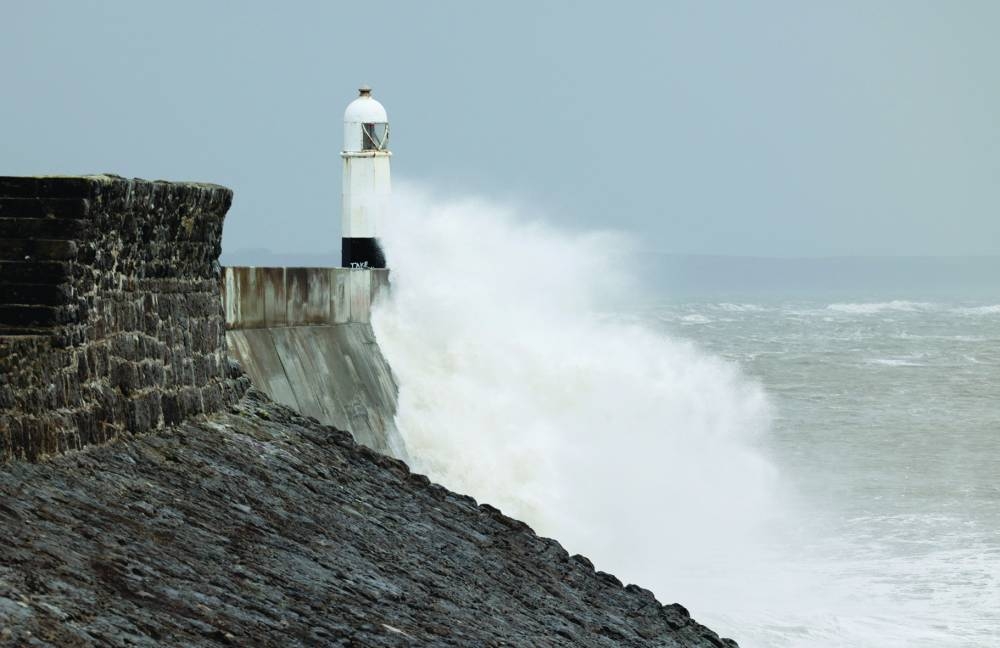 
A wave crashes into the shore after Storm Darragh hit the country, in Porthcawl, Wales, Britain. 