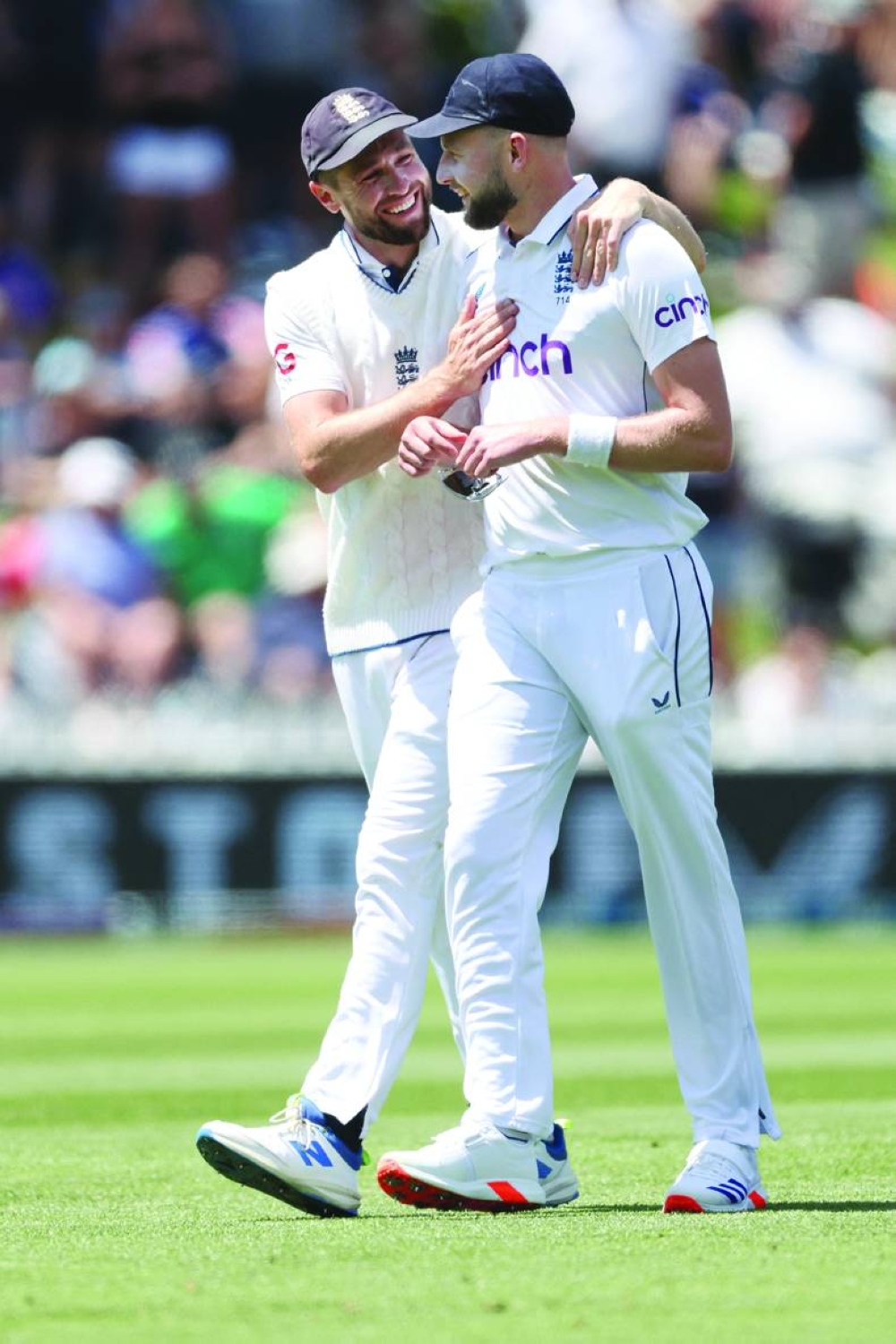England’s Gus Atkinson (right) walks from the field with teammate Chris Woakes in Wellington on Saturday. (AFP)
