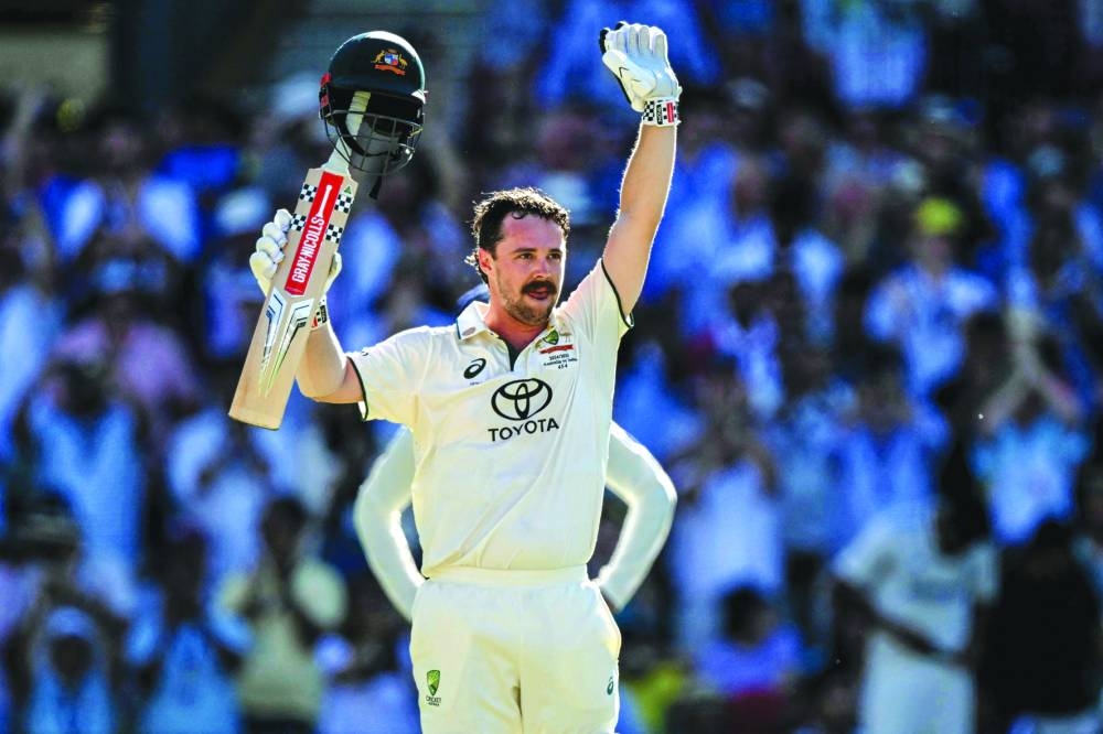 Australia’s Travis Head celebrates after scoring a century on the second day of the second Test against India at the Adelaide Oval in Adelaide on Saturday. (AFP)