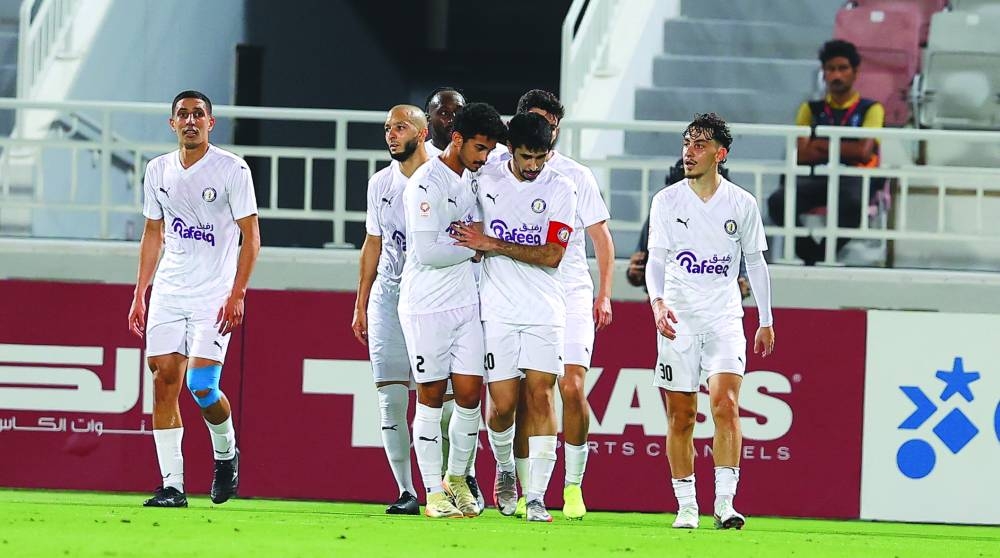 Al Khor’s captain Ahmad Hassan al-Mohannadi (third right) celebrates with teammates after scoring against Al Duhail on Saturday.