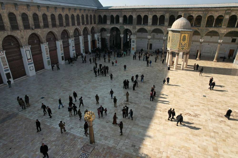 This aerial view shows people visiting the Umayyad Mosque in Damascus, on Monday. AFP