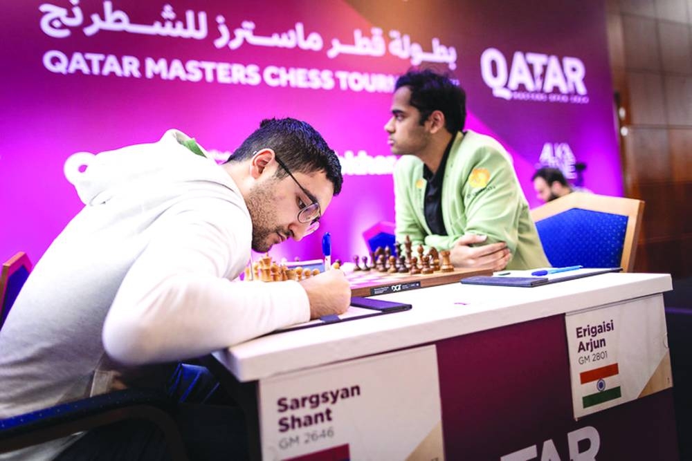 
Armenian GM Shant Sargsyan (left) notes down a move during his game against Indian GM Arjun Erigaisi during the Qatar Masters yesterday. PICTURES: Anna Shtourman 