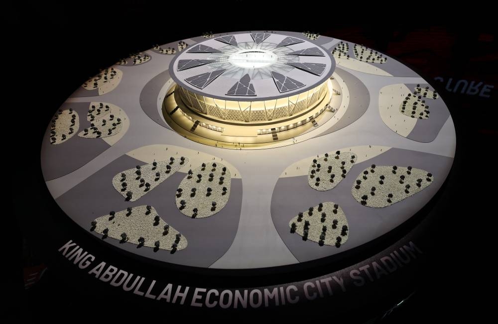 A model of the proposed King Abdullah Economic City Stadium is seen inside the Saudi Arabia World Cup bid exhibition. REUTERS