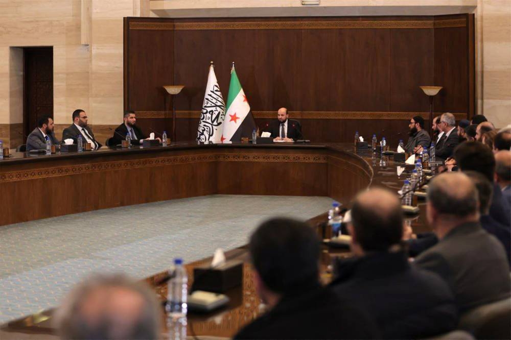 Syria's new transitional prime minister Mohammad al-Bashir chairing a meeting of the new cabinet in Damascus on Tuesday. AFP PHOTO / SANA Telegram Channel.