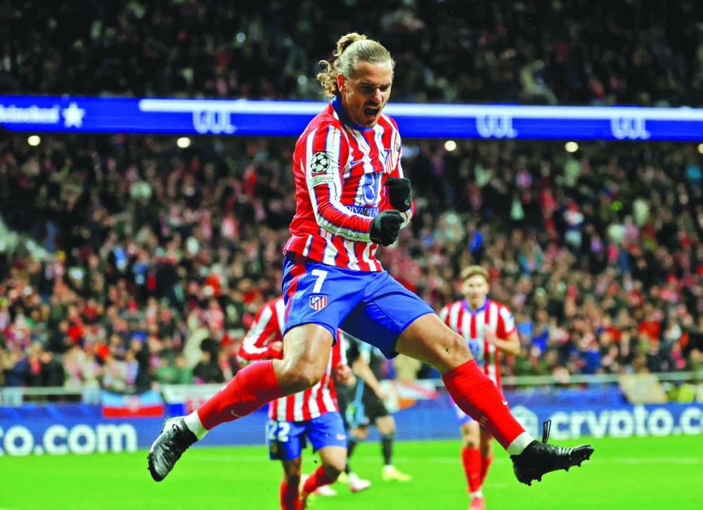 Atletico Madrid’s forward Antoine Griezmann celebrates scoring his team’s second goal during the UEFA Champions League match against Slovan Bratislava at the Metropolitano stadium in Madrid on Wednesday. (AFP)