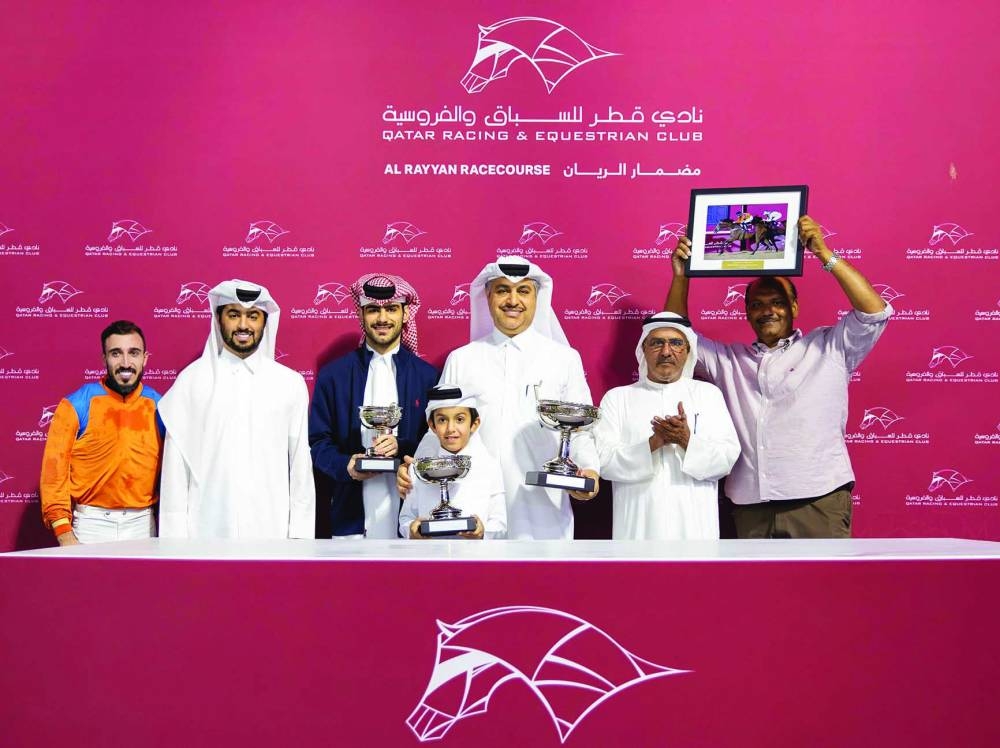 Team Dubawi Spectre celebrate after the four-year-old gelding won the Brooq Cup at the Al Rayyan Racecourse on Wednesday. PICTURE: Juhaim