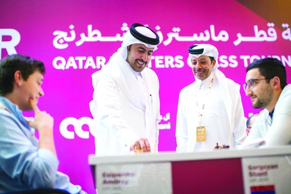 
Ooredoo’s Sabah Rabiah al-Kuwari makes the ceremonial first move during the Qatar Masters game between Russia’s Andrey Esipenko and Armenia’s Shant Sargsyan. Qatar Chess Association President Mohammed al-Mudahka is also seen.  