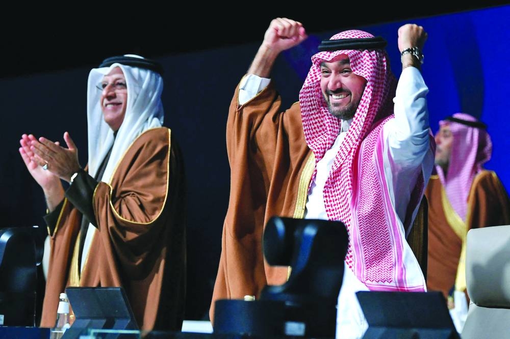 
Asian Football Confederation President Sheikh Salman bin Ibrahim al-Khalifah (left) and Saudi Arabia’s Minister of Sports and Youth Abdulaziz bin Turki al-Faisal al-Saud celebrate after Saudi Arabia was confirmed as host of the 2034 World Cup during a ceremony in Riyadh. (AFP) 