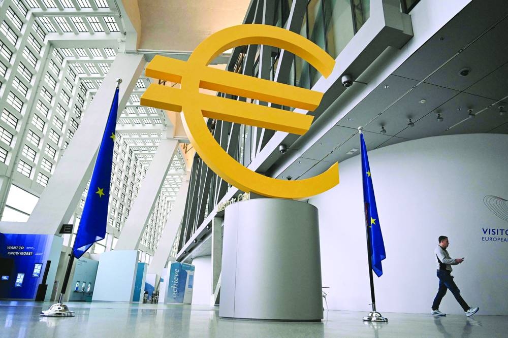 A euro sign is seen at the visitors centre of the European Central Bank at its headquarters in Frankfurt am Main. The central bank for the 20 countries that use the euro reduced its key deposit rate a quarter point to 3%, as widely expected.