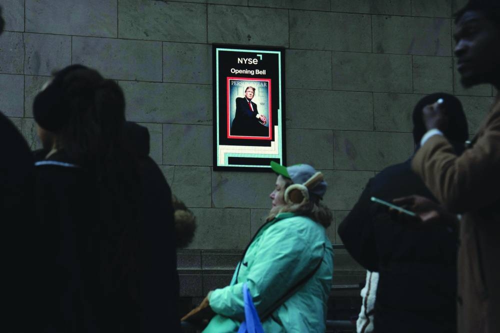 A photo of US President-elect Trump on the cover of Time magazine is displayed outside the New York Stock Exchange (NYSE) on Thursday. – AFP