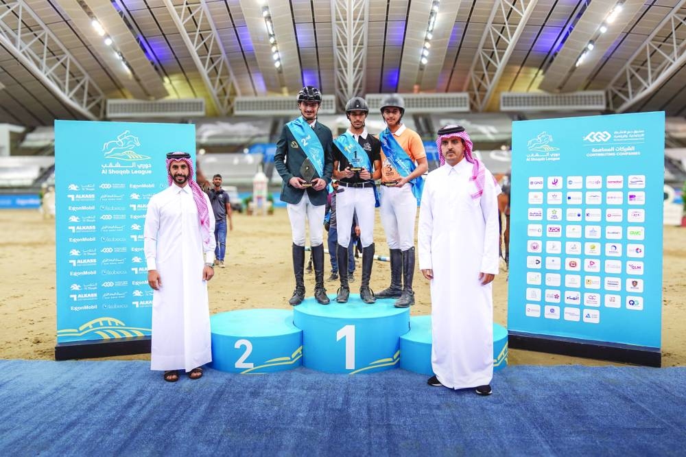 FEI certified judge Nasser Mubarak al-Hajri and Director of the Al Shaqab League Khalid Sanad al-Nuaimi pose with podium winners of the Youth Champions 105cm class at Al Shaqab on Friday. Faris Saad al-Qahtani took the top spot, ahead of Khaled al-Hady and Ibrahim Yousef al-Mahmoud.