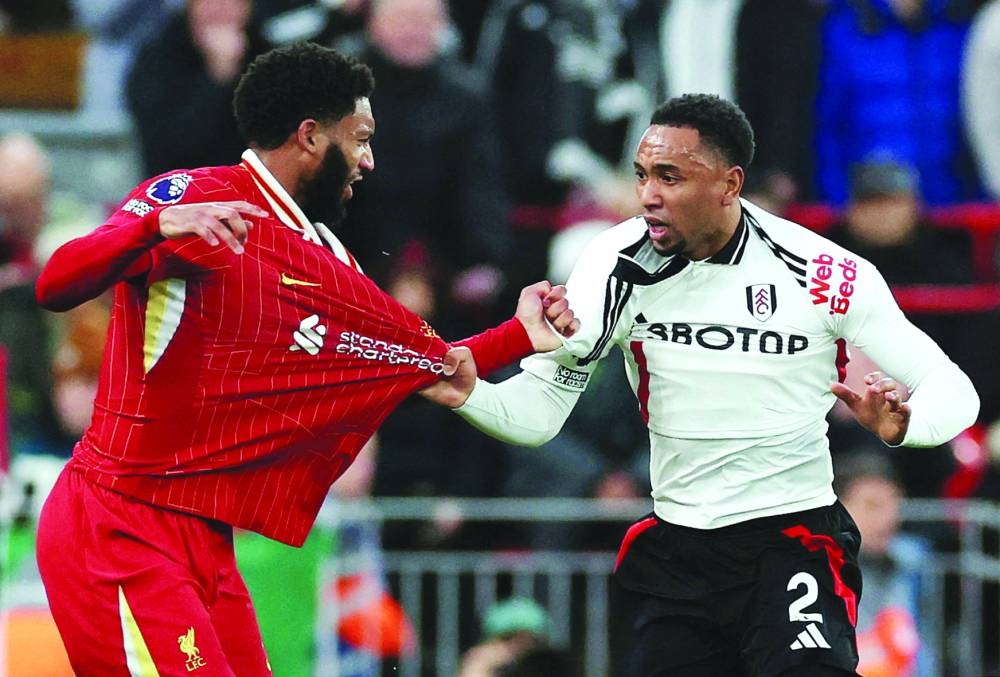 Fulham’s Kenny Tete (right) clashes with Liverpool’s Joe Gomez during the Premier League match at Anfield in Liverpool on Saturday. (Reuters)