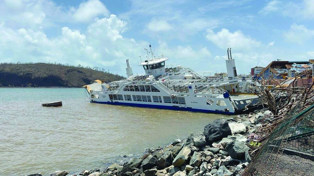 The “Karihani” inter-island barge stranded among debris in Mamoudzou after the Cyclone Chido hit France’s Indian Ocean territory of Mayotte. (AFP)
