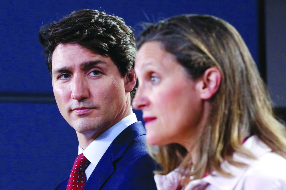 NOT SEEING EYE-TO-EYE: Prime Minister Justin Trudeau listening to Chrystia Freeland during a news conference in Ottawa in this file photo. (Reuters) 
