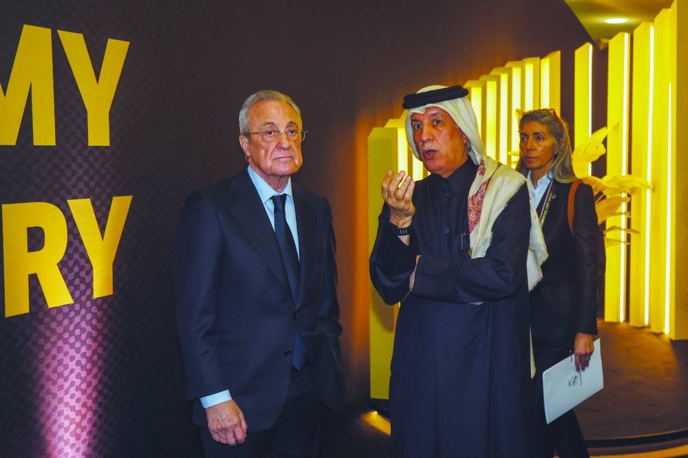 
Qatar’s Minister of State for Foreign Affairs Sultan bin Saad al-Muraikhi speaks to Real Madrid president Florentino Perez during the Best FIFA Football Awards 2024 ceremony at Aspire Academy. (AFP) 