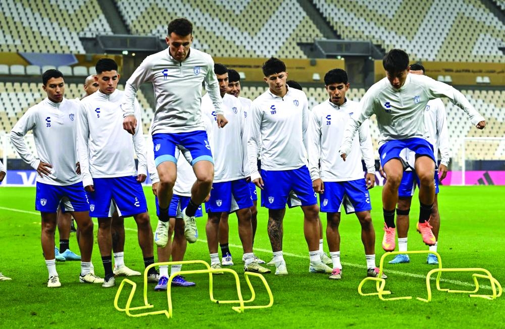 Pachuca player’s warm up before a training session at the Lusail Stadium yesterday.