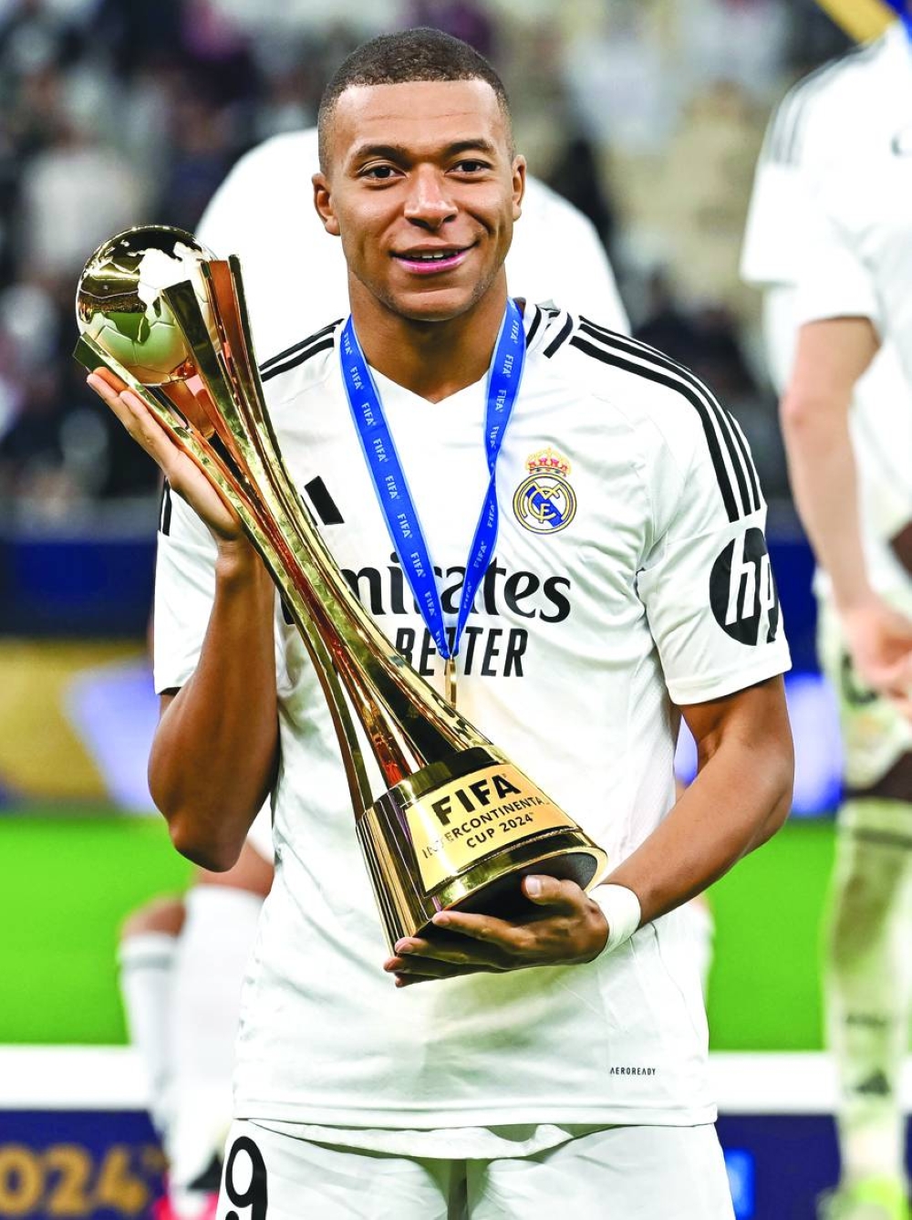 Kylian Mbappe poses with the trophy. PICTURE: Noushad Thekkayil