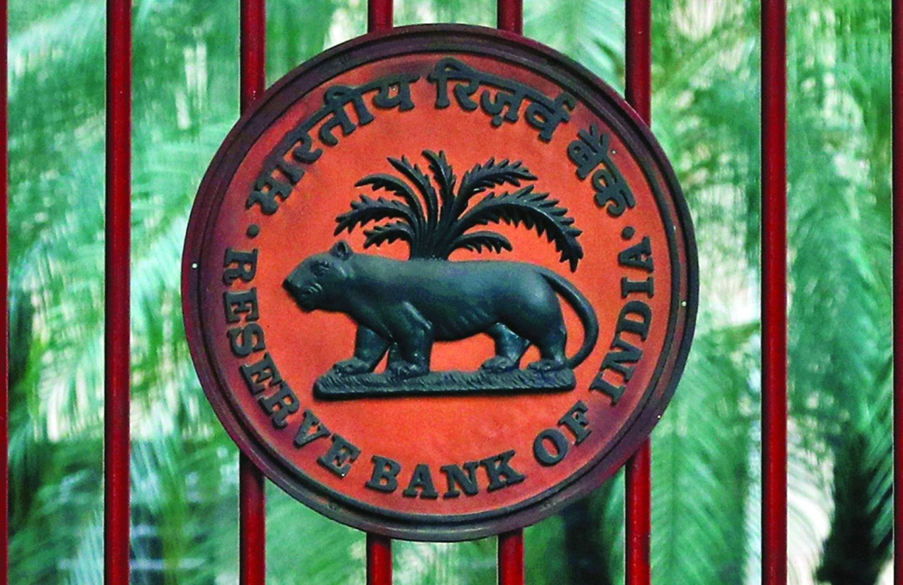 The Reserve Bank of India logo is seen at the gate of its office in New Delhi. While global factors weigh on the rupee, traders will be focusing on the central bank’s foreign exchange market interventions as new Governor Sanjay Malhotra succeeds a monetary regime that had firmly curbed volatility in the currency.
