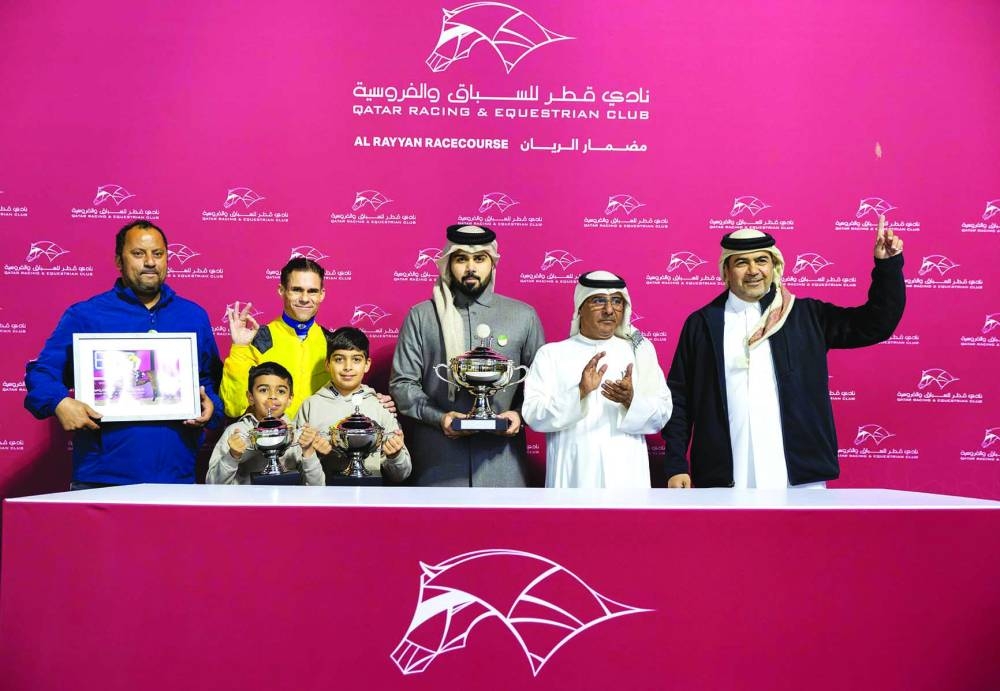 Connections of Jungle Mate celebrate after the three-year-old gelding won the Ras Laffan Cup on Friday. PICTURES: Juhaim