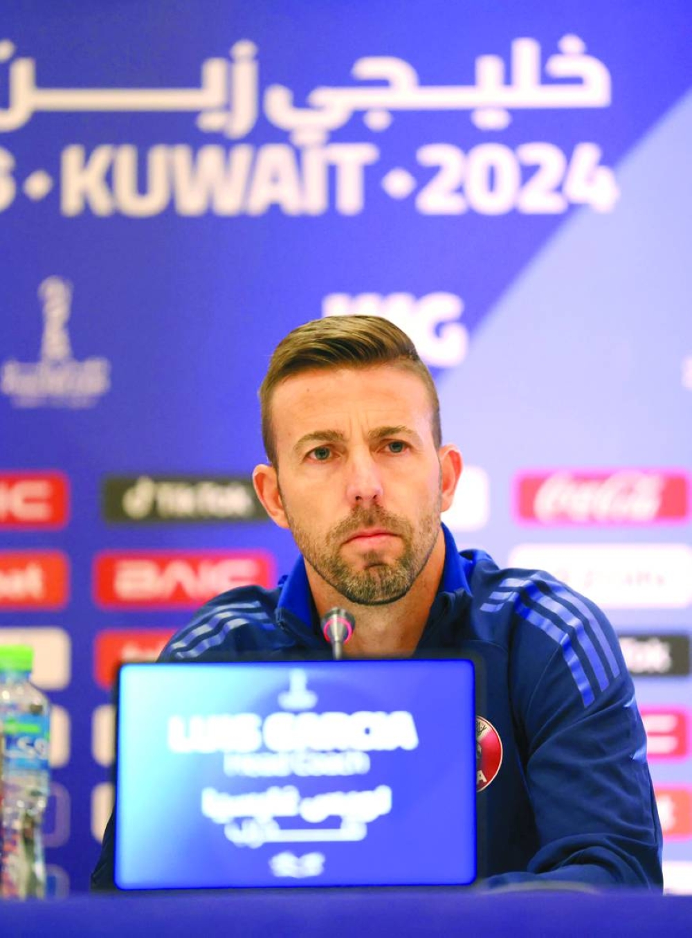 Qatar coach Luis Garcia address the media in Kuwait City.