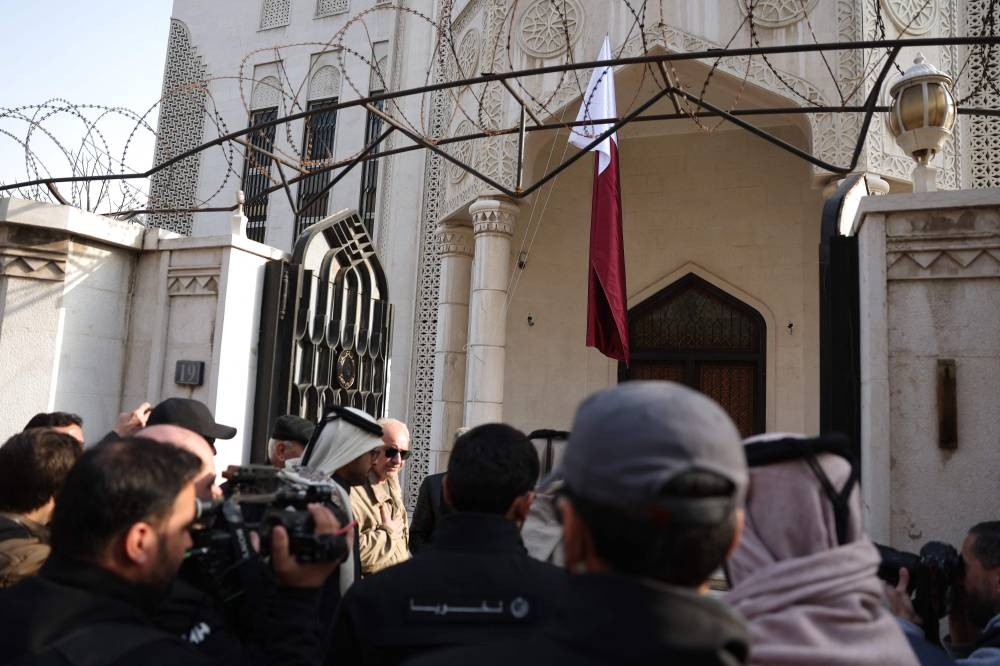 Members of the Qatari diplomatic delegation arrive for the official reopening of the embassy in Damascus on Saturday. AFP