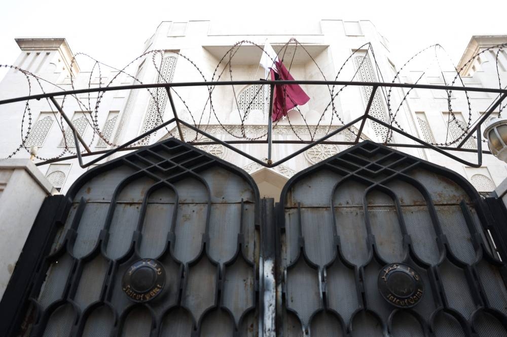 The flag of Qatar hangs on the Embassy building ahead of it's scheduled reopening in Damascus on Saturday. AFP