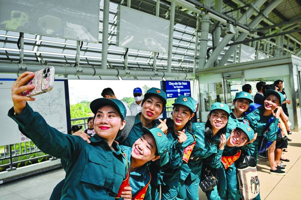 Soldiers take a selfie on the plateform at a metro station in Ho Chi Minh City yesterday.