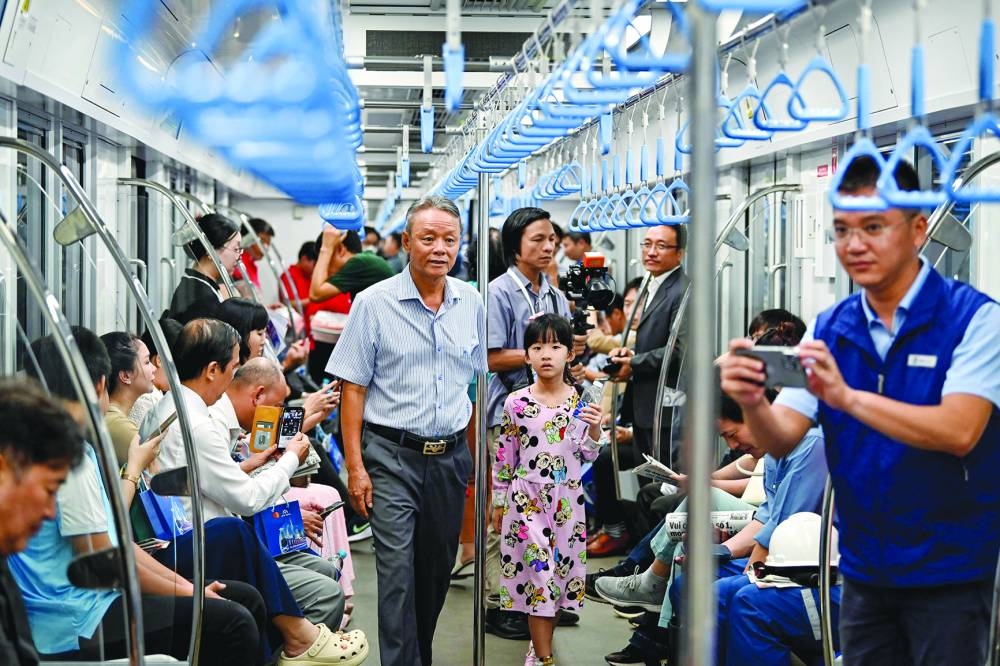 
Passengers are seen on a train of the Line 1 of the HCMC Metro in Ho Chi Minh City yesterday. 