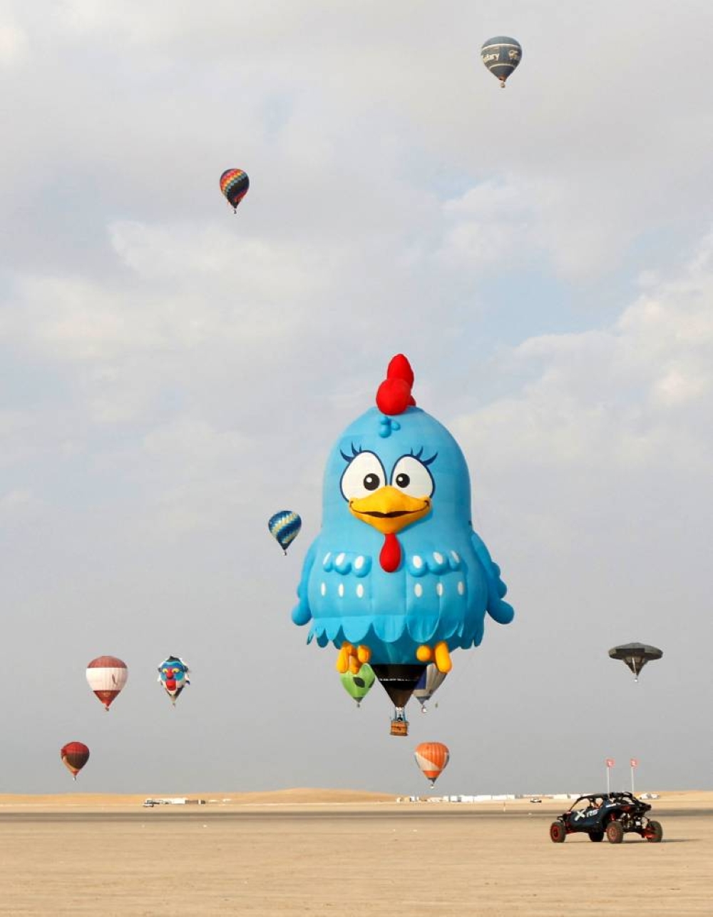 Hot air balloons rise in the sky during the Qatar Hot Air Balloon Festival in the Sealine desert on Saturday. AFP