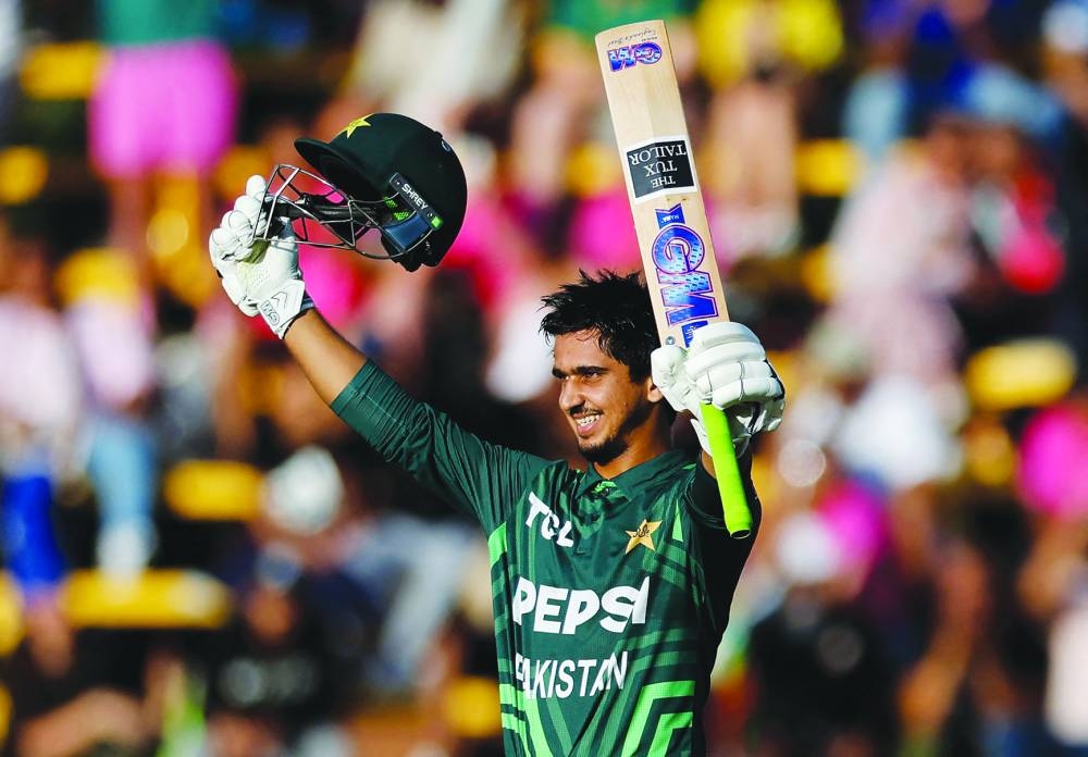 Pakistan’s Saim Ayub celebrates after scoring a century during the third one day international match against South Africa at The Wanderers Stadium in Johannesburg yesterday. (AFP)