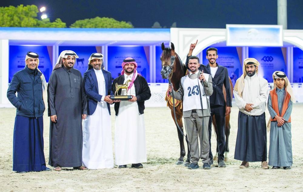 
Connections of D Shajei celebrate with the trophy. PICTURES: Juhaim 