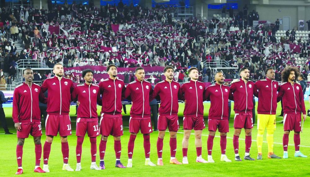 
Qatar players sing the national anthem before their Arabian Gulf Cup match against the UAE in Kuwait City on Saturday. 