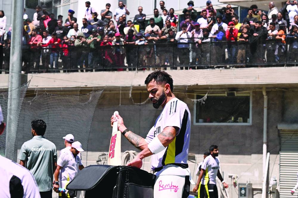 Indian batsman Virat Kohli packs his bats away in the nets at the Melbourne Cricket Ground on Tuesday. (AFP)