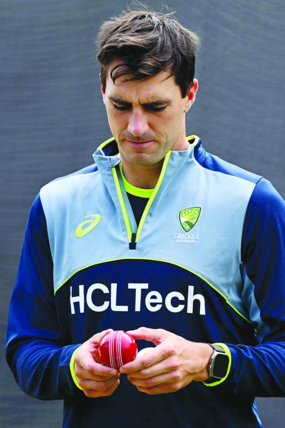 
Australian captain Pat Cummins inspects a ball in the nets at the Melbourne Cricket Ground. (AFP) 