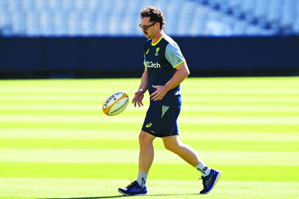 Australian batsman Travis Head bounces a football at the Melbourne Cricket Ground in Melbourne ahead of the fourth Test against India starting on Thursday. (AFP)
