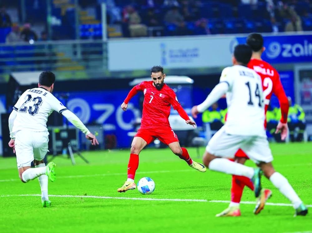 
Bahrain’s Ali Madan (centre) scores against Iraq during the 26th Arabian Gulf Cup at the Jaber Al Ahmad International Stadium. 