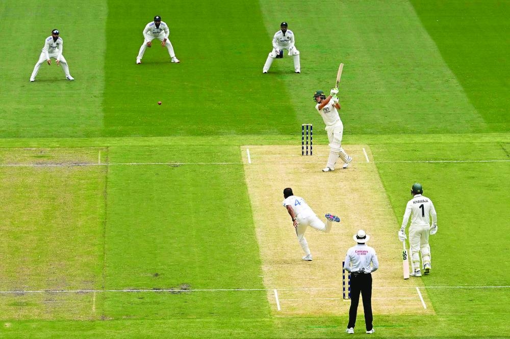 India’s Akash Deep bowls to Australia’s Sam Konstas (also inset) on the first day of the fourth Test at the Melbourne Cricket Ground in Melbourne on Thursday. (AFP)