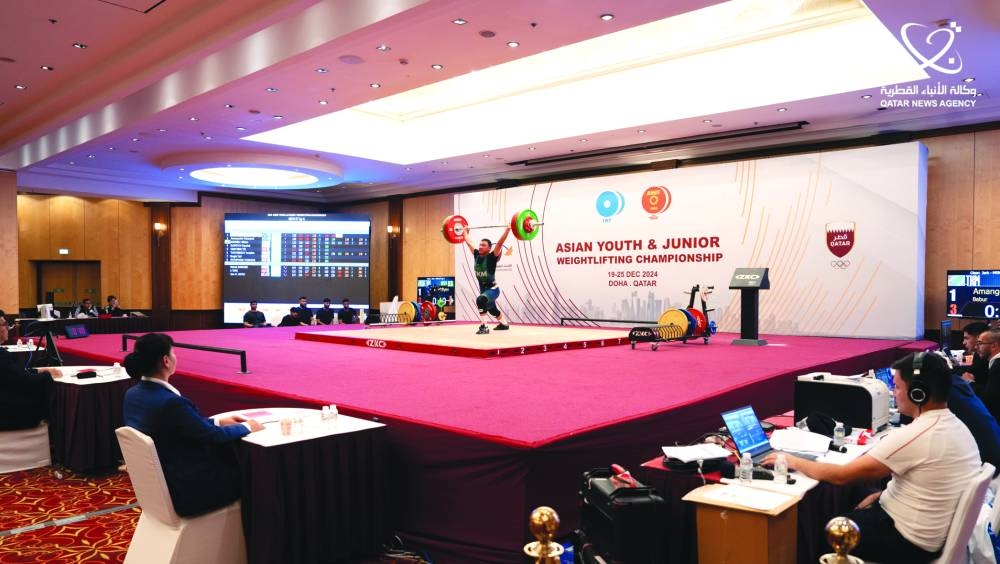 
A participant in action during the Asian Youth and Junior weightlifting Championship held in Doha. 
